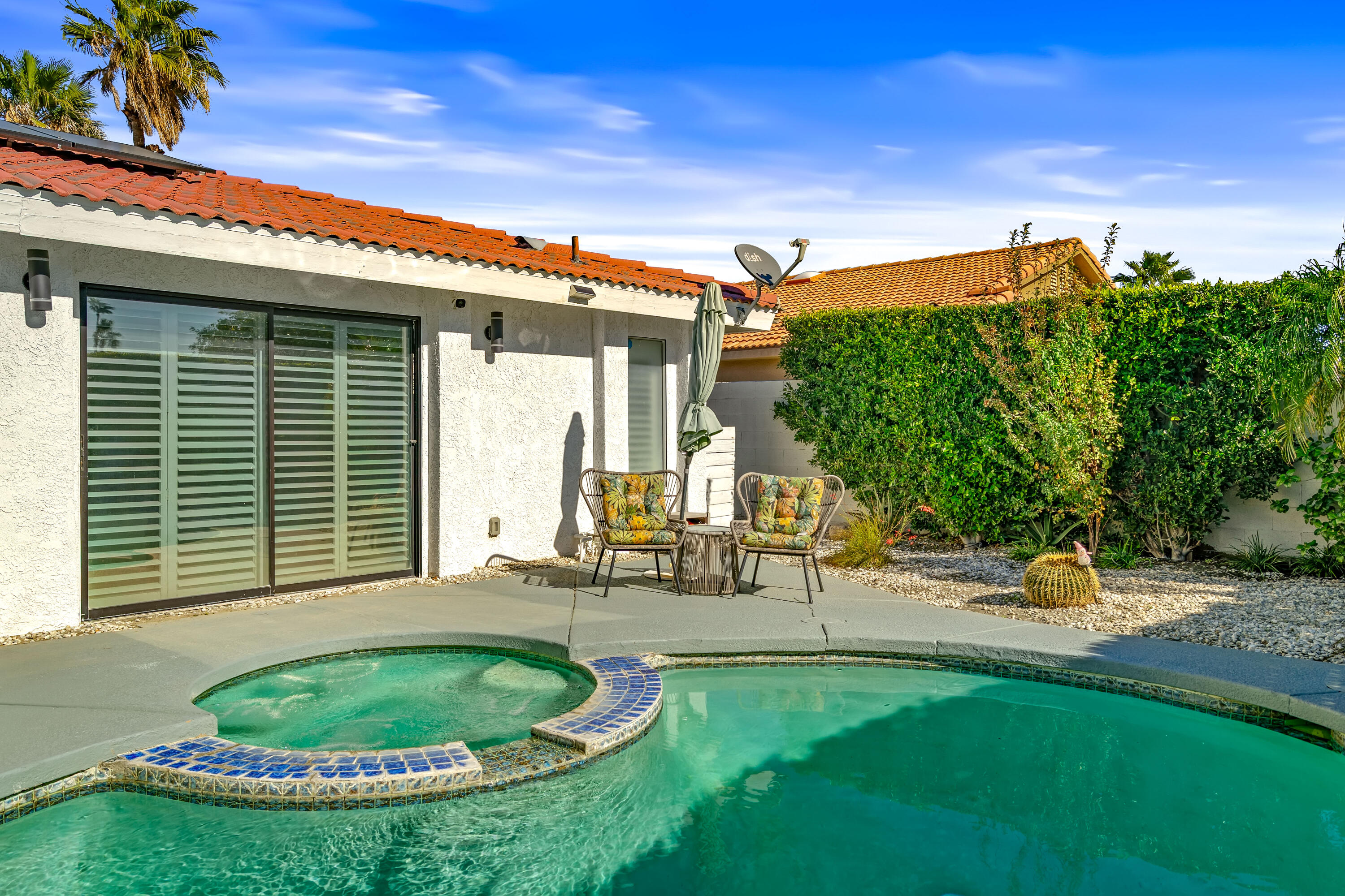 67265 Rango Road Cathedral City, CA 92234 - Photo 39 of 49 a backyard of a house with table and chairs
