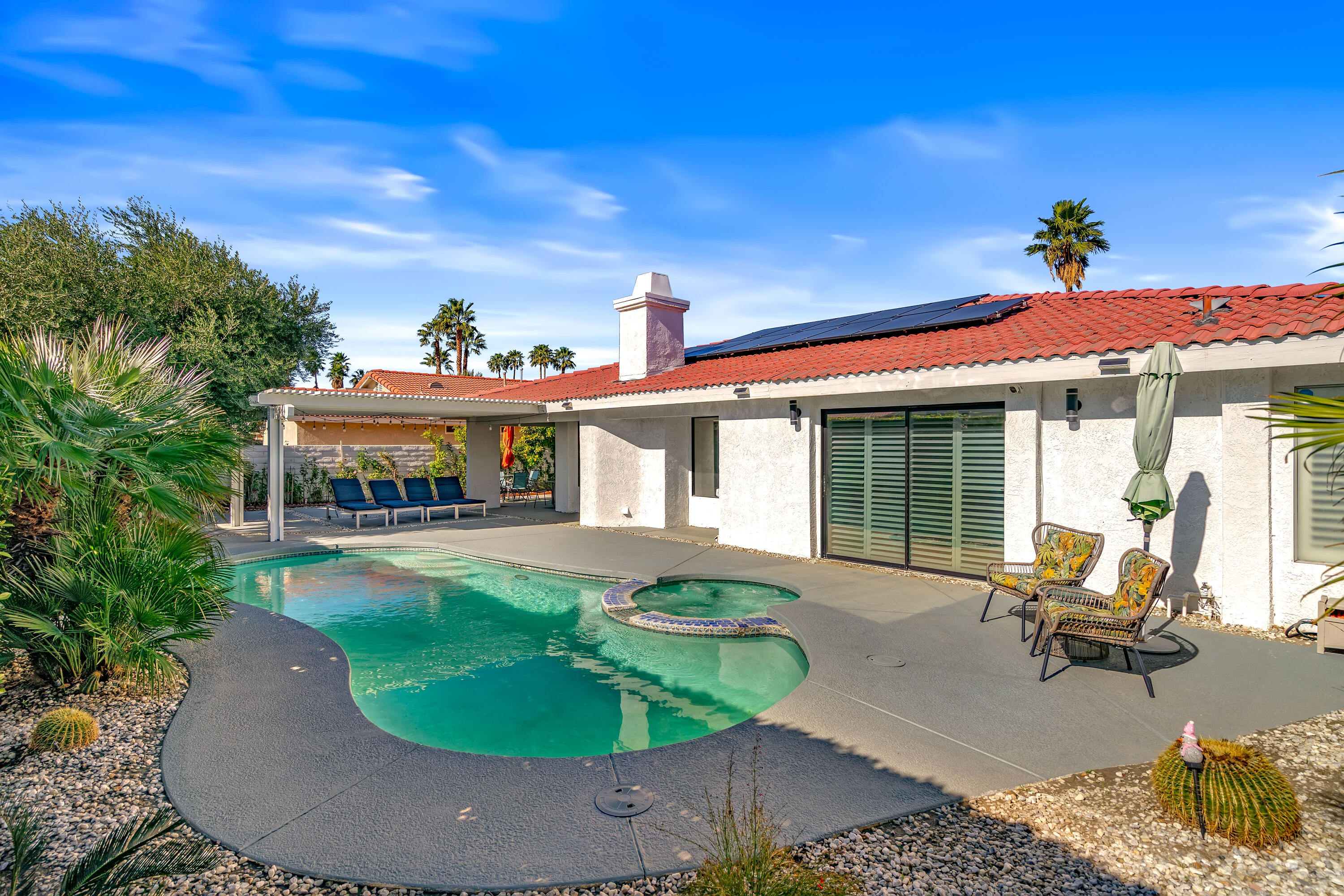 67265 Rango Road Cathedral City, CA 92234 - Photo 40 of 49 a view of a house with swimming pool and sitting area
