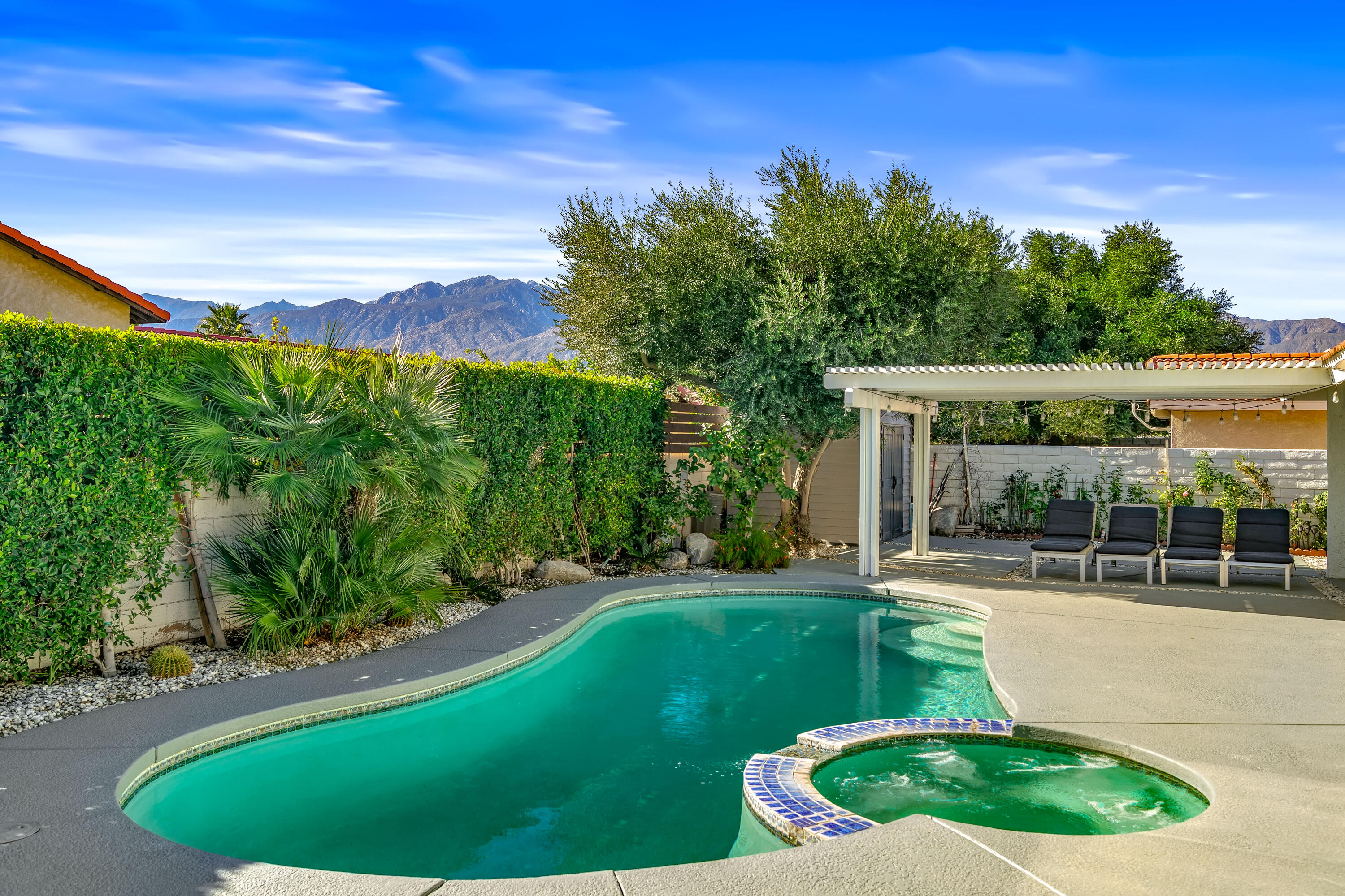67265 Rango Road Cathedral City, CA 92234 - Photo 42 of 49 a view of a backyard with a garden and plants