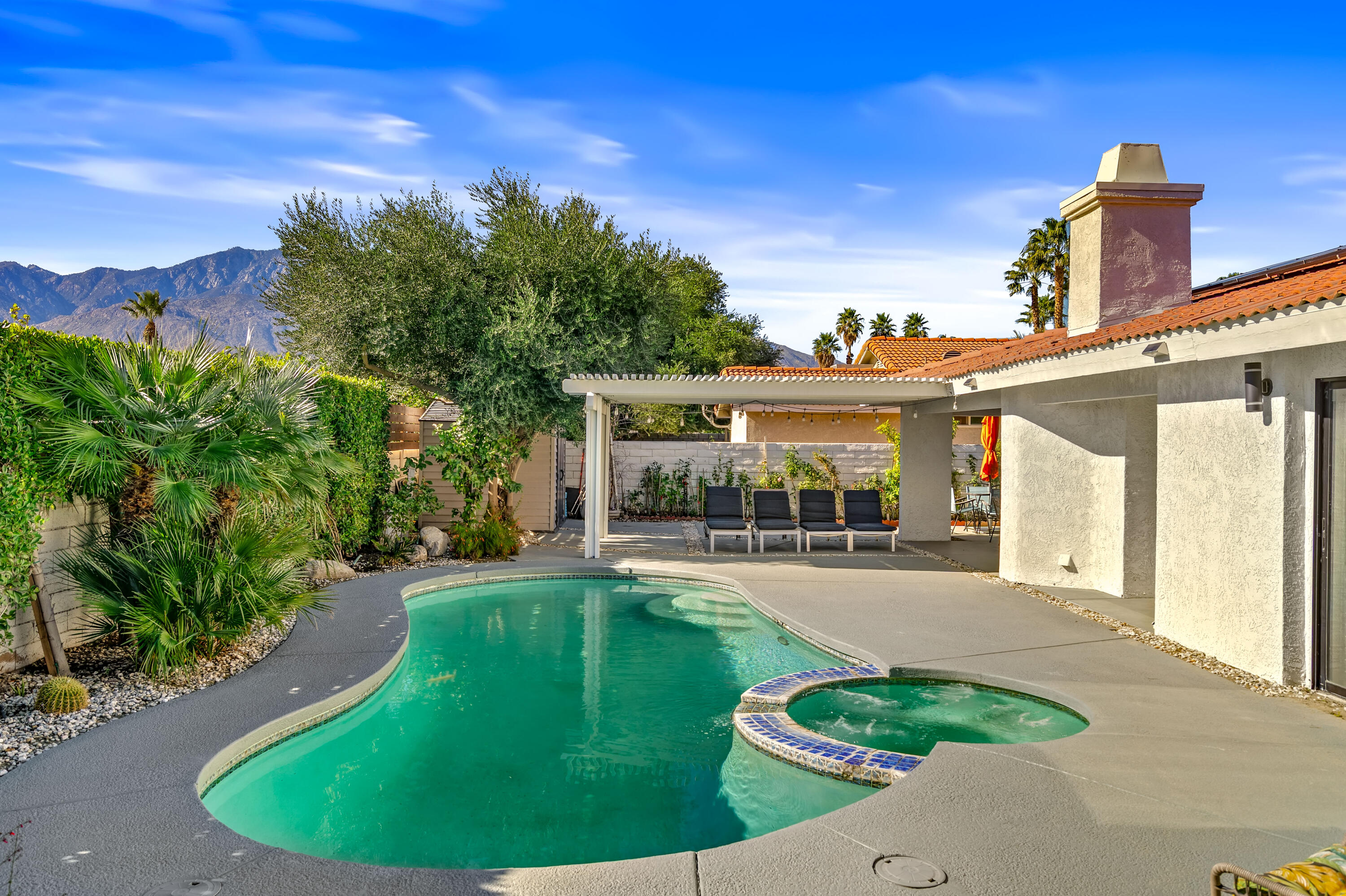 67265 Rango Road Cathedral City, CA 92234 - Photo 43 of 49 a view of a house with a backyard porch and sitting area