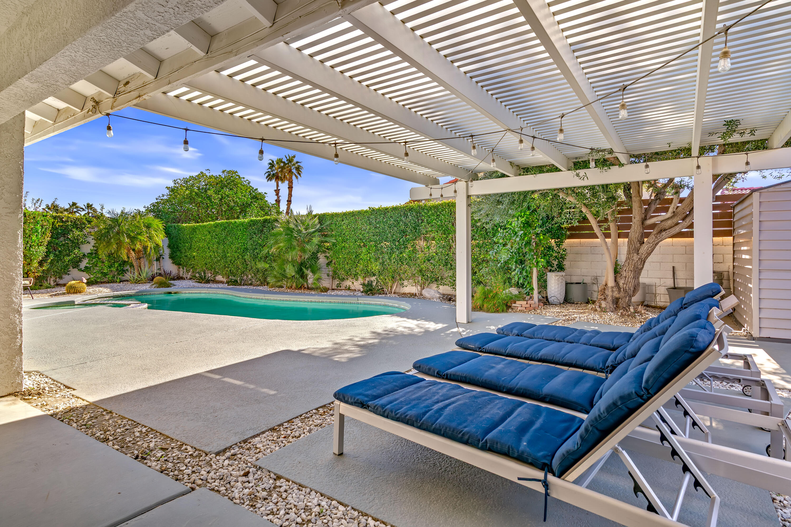 67265 Rango Road Cathedral City, CA 92234 - Photo 45 of 49 a outdoor living space with patio furniture and a garden