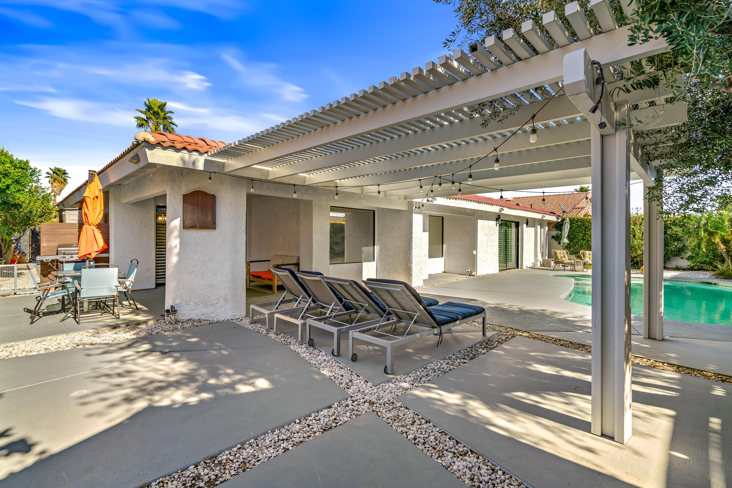 67265 Rango Road Cathedral City, CA 92234 - Photo 46 of 49 a front view of a house with outdoor seating