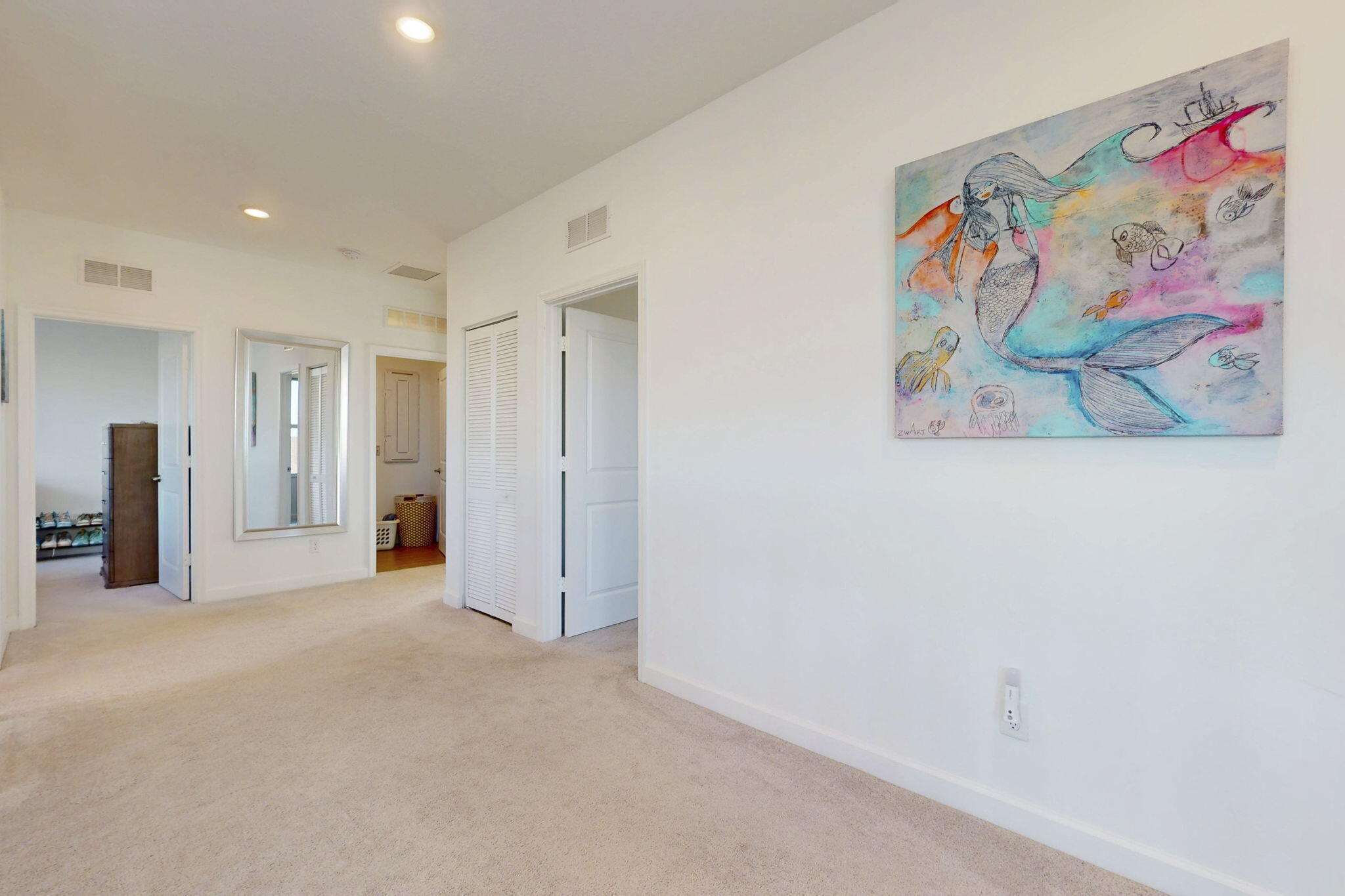 1319 Arrowhead Point Road Loxahatchee, FL 33470 - Photo 12 of 45 a view of a hallway with a painting on the wall