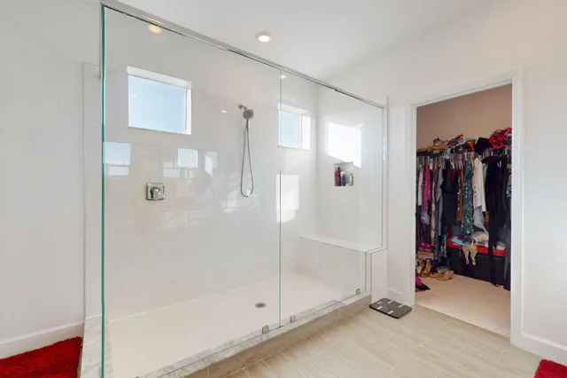 a bathroom with a sink mirror vanity and toilet