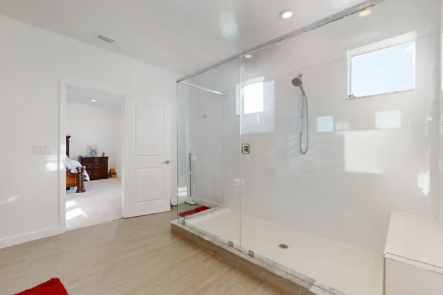 a view of a house with a patio and a yard