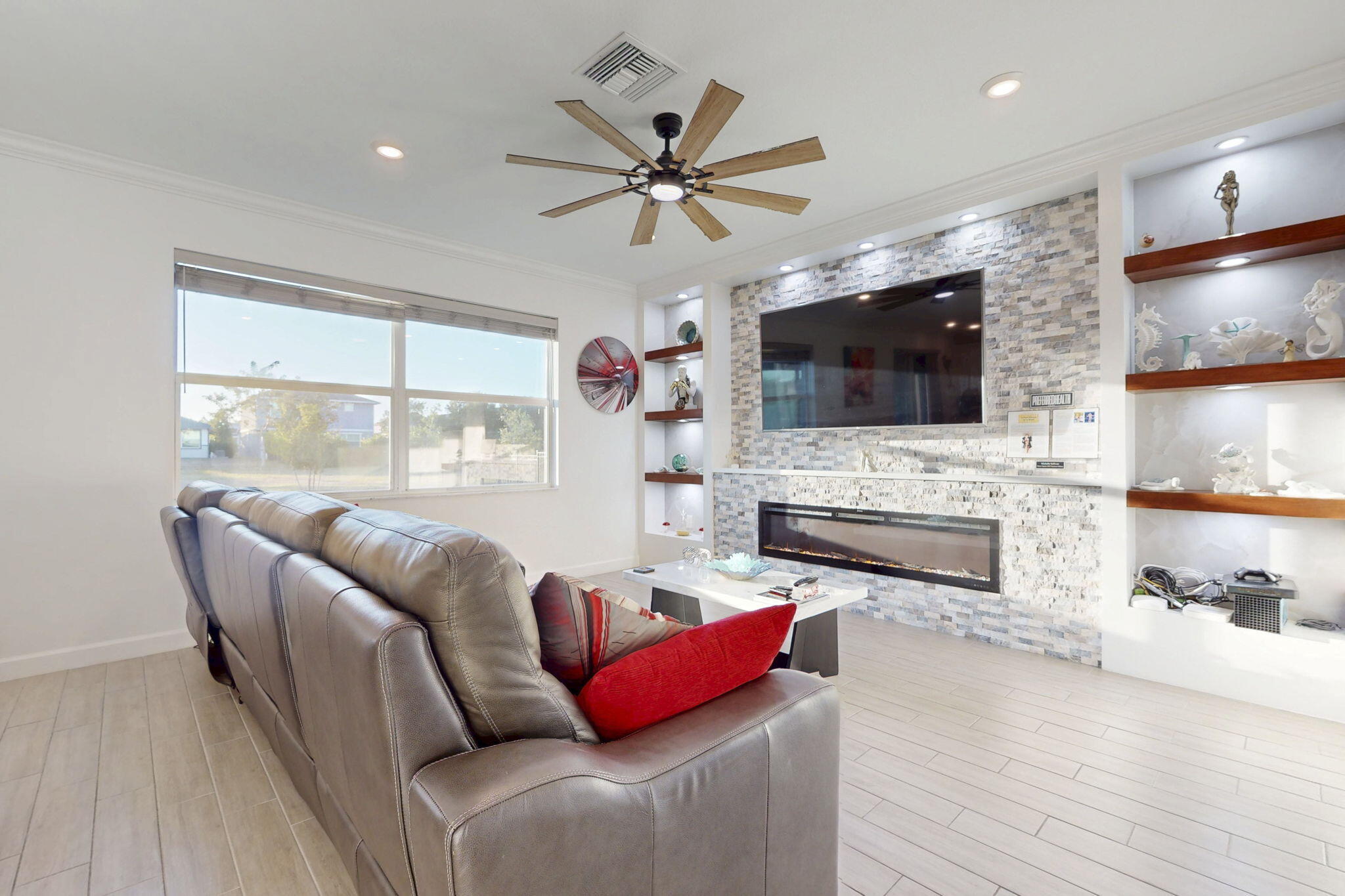 1319 Arrowhead Point Road Loxahatchee, FL 33470 - Photo 2 of 45 a living room with fireplace furniture and a flat screen tv