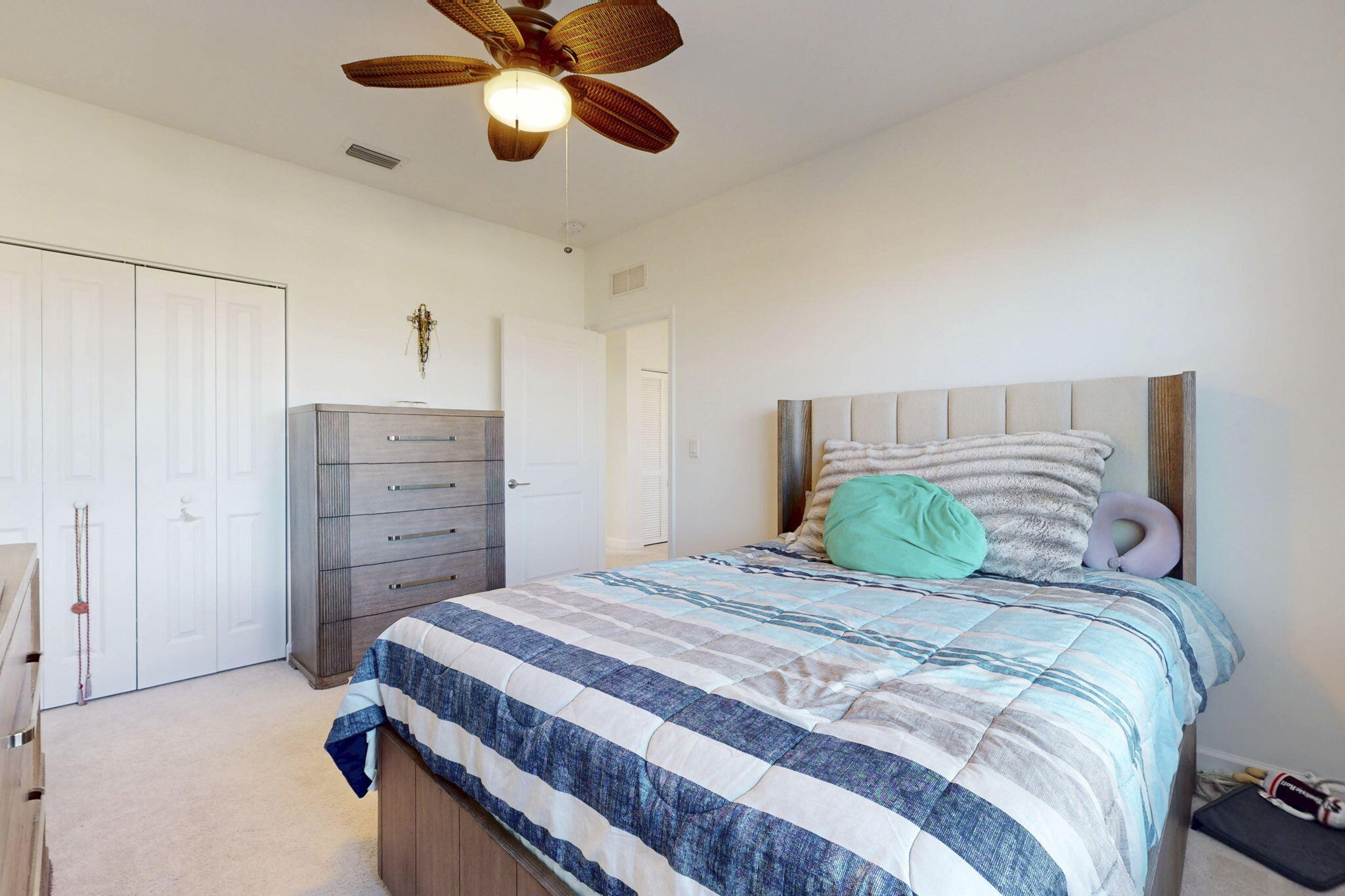 1319 Arrowhead Point Road Loxahatchee, FL 33470 - Photo 22 of 45 a bedroom with a bed and a chandelier