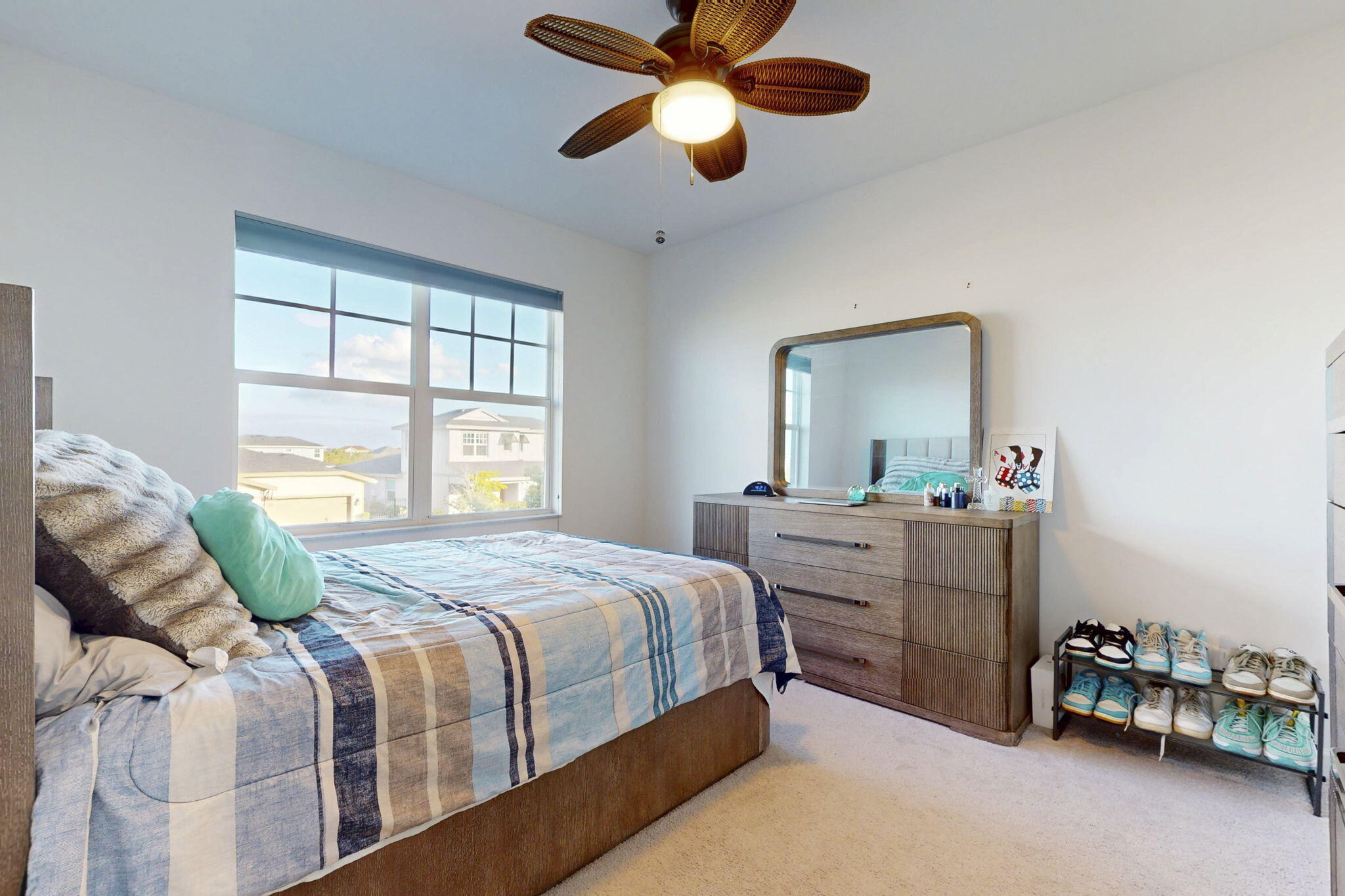 1319 Arrowhead Point Road Loxahatchee, FL 33470 - Photo 23 of 45 a bedroom with a bed and a chandelier fan