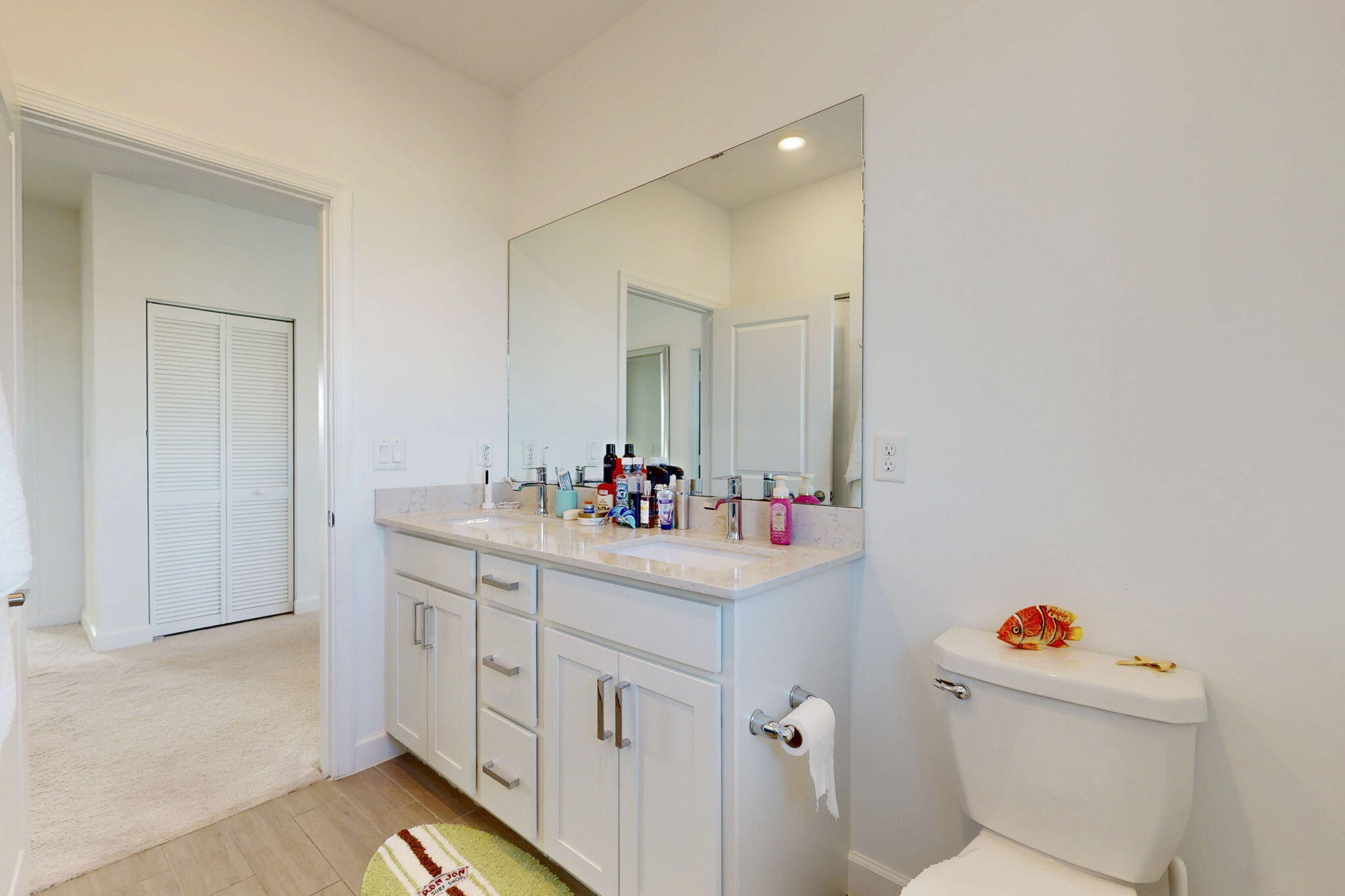 1319 Arrowhead Point Road Loxahatchee, FL 33470 - Photo 25 of 45 a bathroom with a sink mirror vanity and toilet