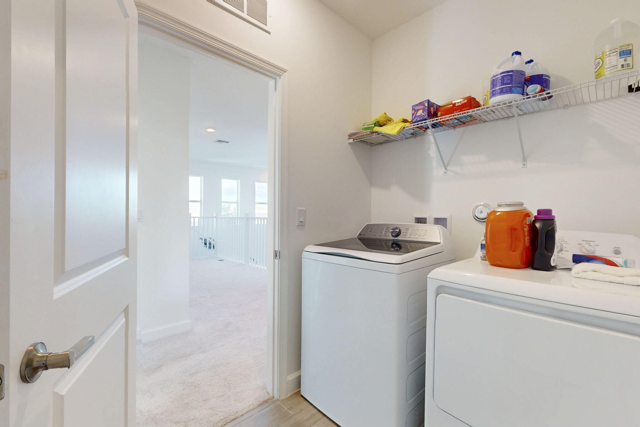 1319 Arrowhead Point Road Loxahatchee, FL 33470 - Photo 26 of 45 a storage room with washer and dryer