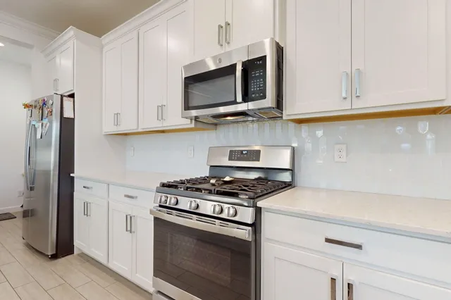 a view of a hallway with a painting on the wall
