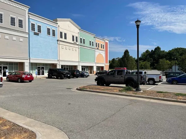 a view of street with parked cars