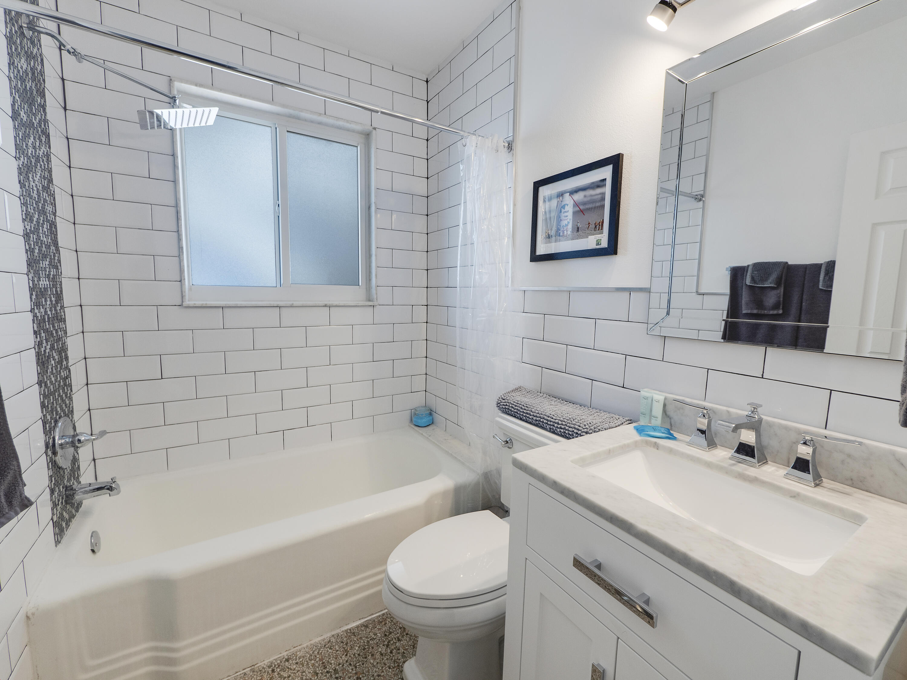 1258 Beach Road, Unit 7 Singer Island, FL 33404 - Photo 6 of 11 a bathroom with a sink toilet and shower