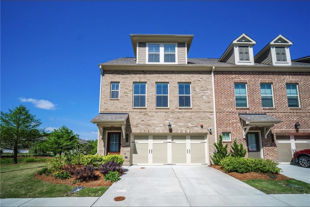 1595 Ridgebrook Downs Mableton, GA 30126 - Photo 2 of 39 a front view of a house with garden