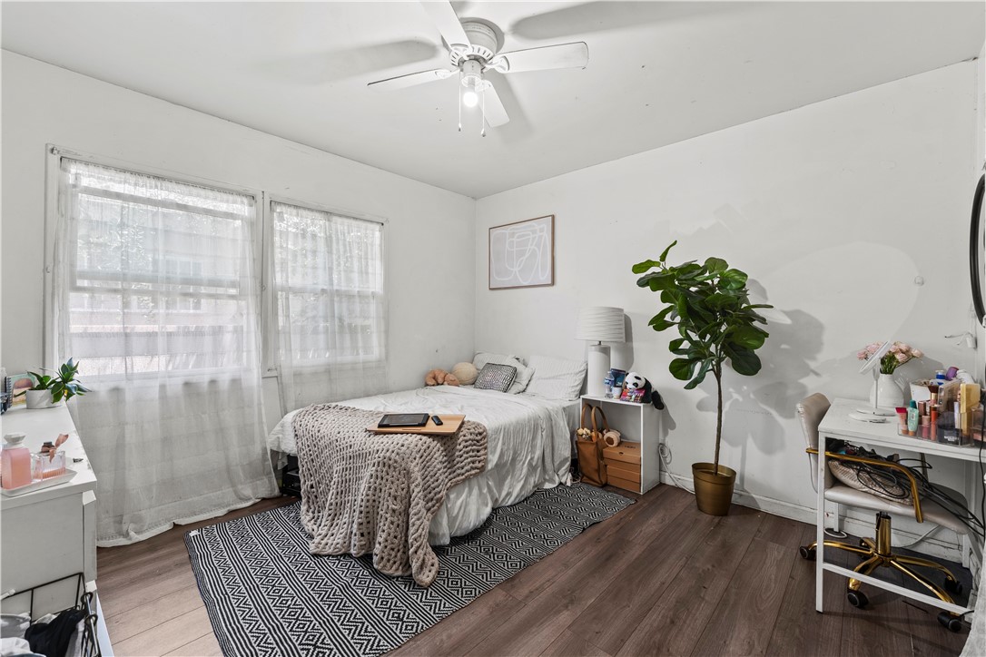 2725 East Tyler Street Carson, CA 90810 - Photo 15 of 30 a bedroom with a bed and a potted plant