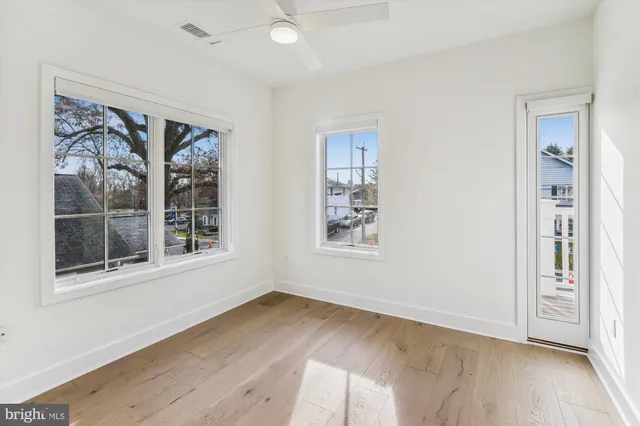 a bathroom with a bathtub a double vanity sink and a mirror