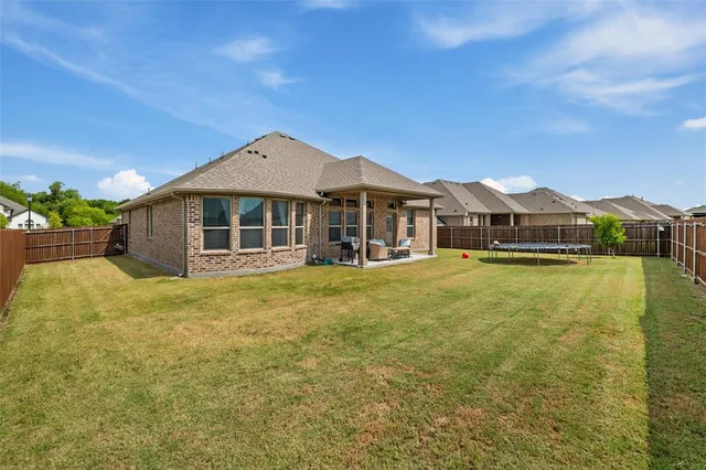 an aerial view of a house with a swimming pool