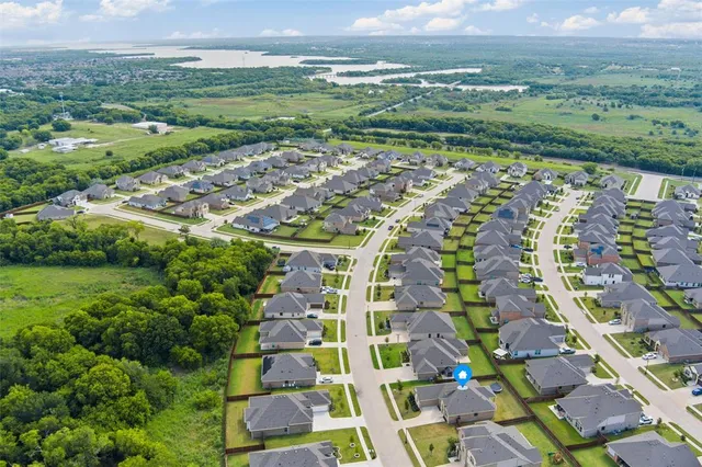an aerial view of a house with outdoor space