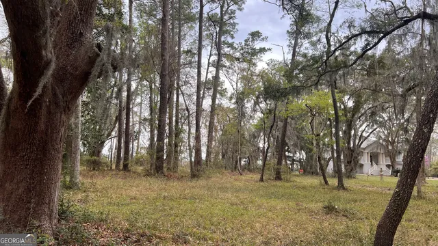 a front view of a house with iron fence