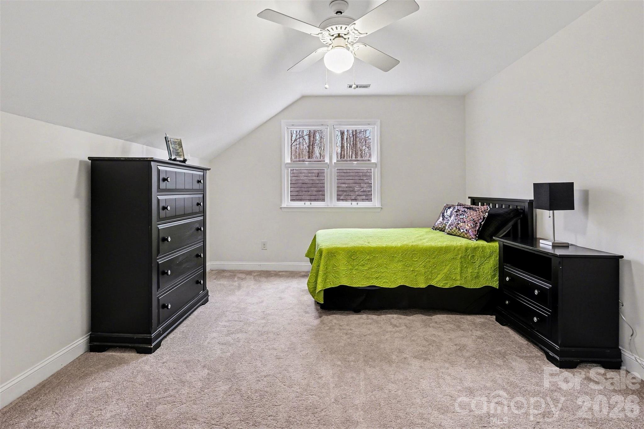 909 Woodland Forest Road Waxhaw, NC 28173 - Photo 11 of 38 a bedroom with a bed and a television