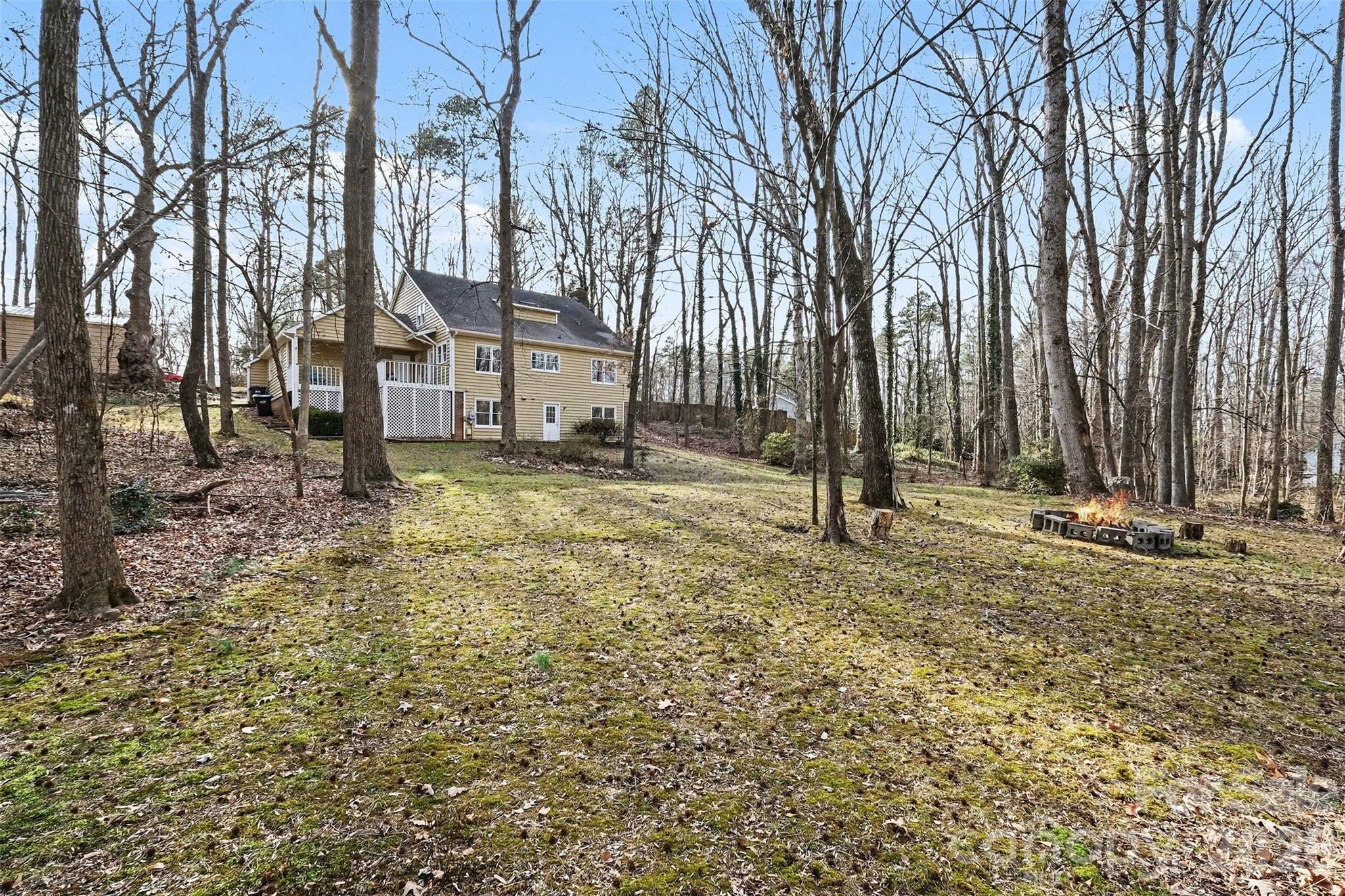 909 Woodland Forest Road Waxhaw, NC 28173 - Photo 15 of 38 a view of a house with a yard and tree s