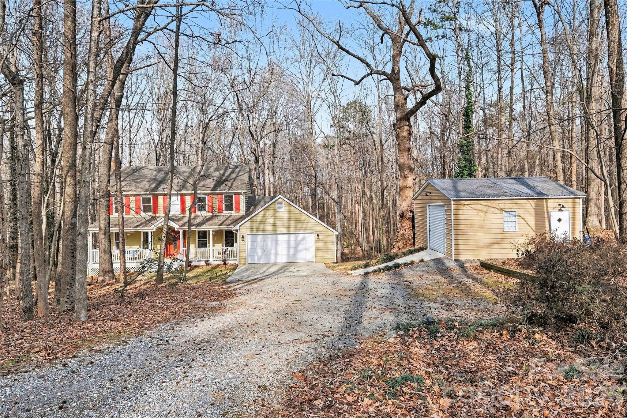 909 Woodland Forest Road Waxhaw, NC 28173 - Photo 17 of 38 a view of an house with a yard and wooden fence