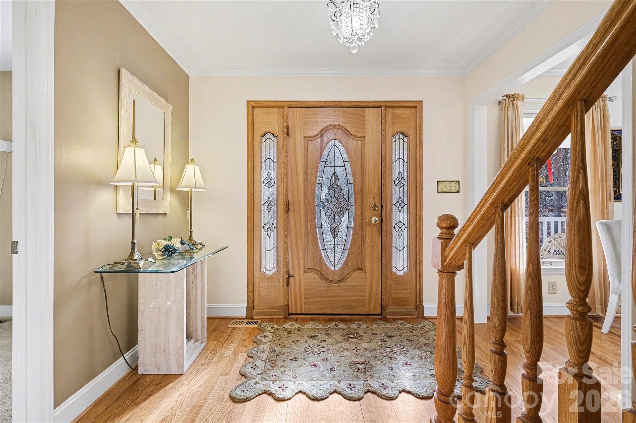 909 Woodland Forest Road Waxhaw, NC 28173 - Photo 20 of 38 a view of an entryway with wooden floor