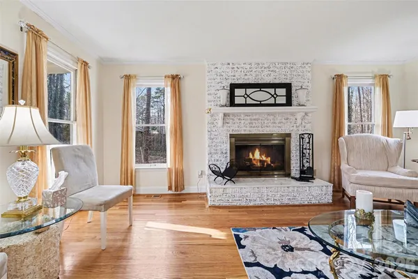 a living room with furniture and a lamp