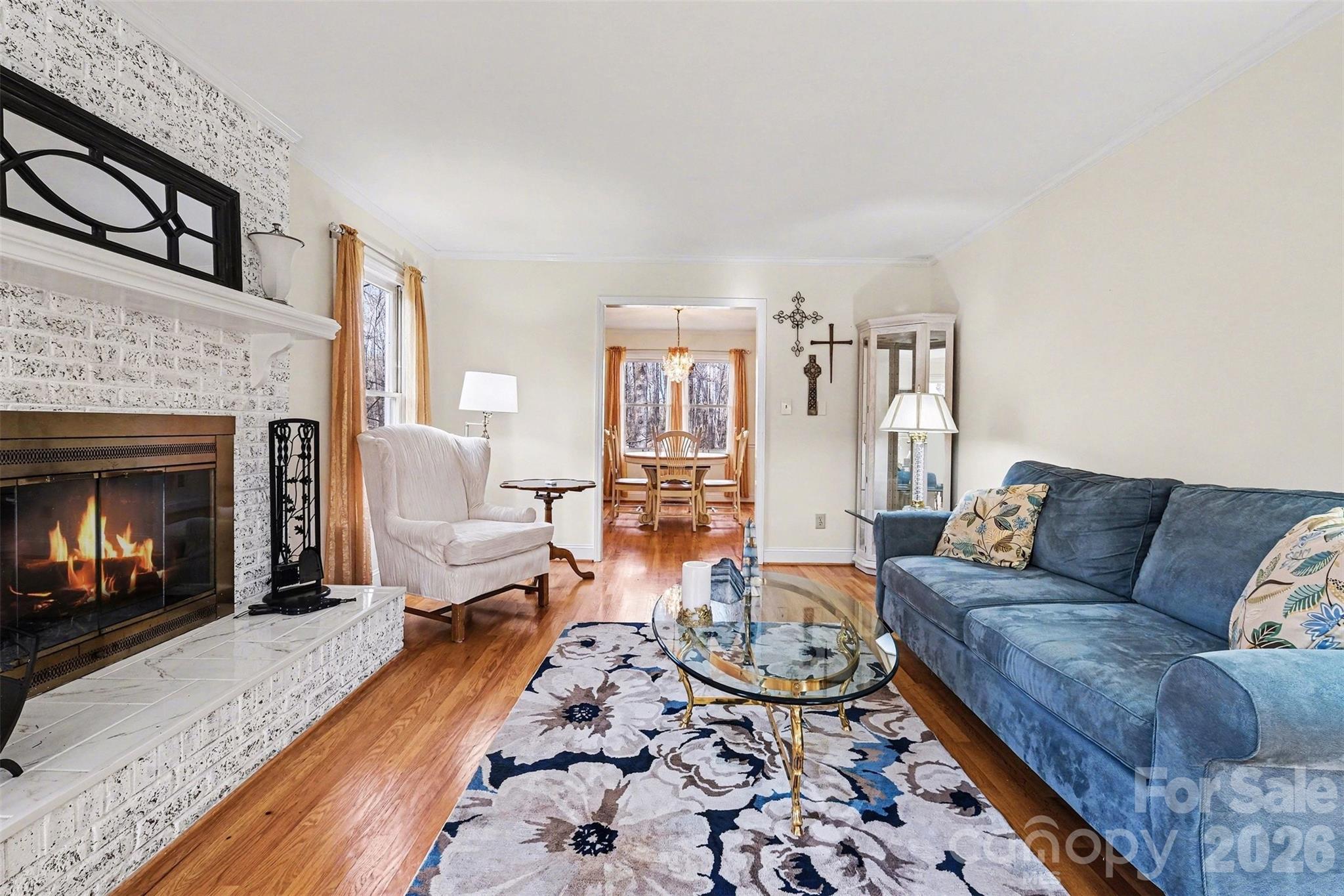 909 Woodland Forest Road Waxhaw, NC 28173 - Photo 25 of 38 a living room with furniture and a fireplace