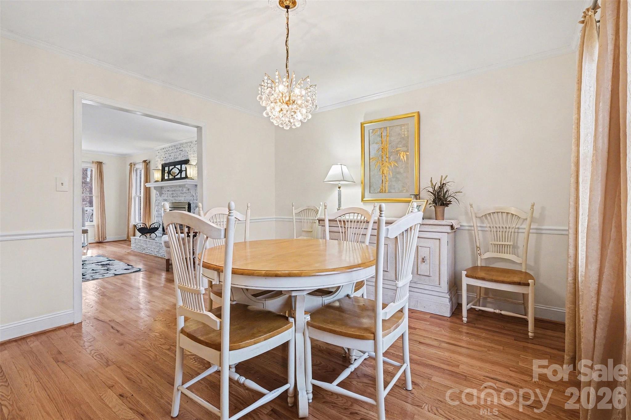 909 Woodland Forest Road Waxhaw, NC 28173 - Photo 26 of 38 a view of a dining room with furniture and chandelier