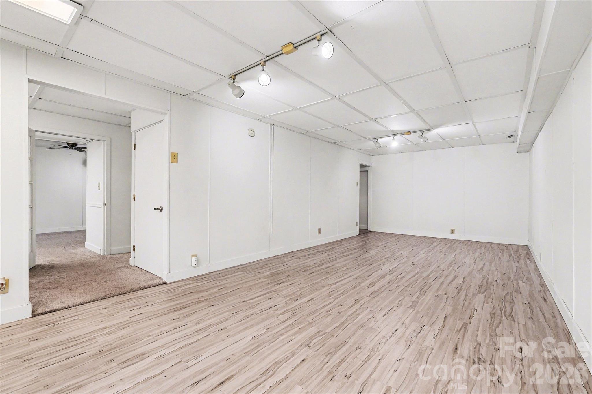 909 Woodland Forest Road Waxhaw, NC 28173 - Photo 33 of 38 wooden floor in an empty room