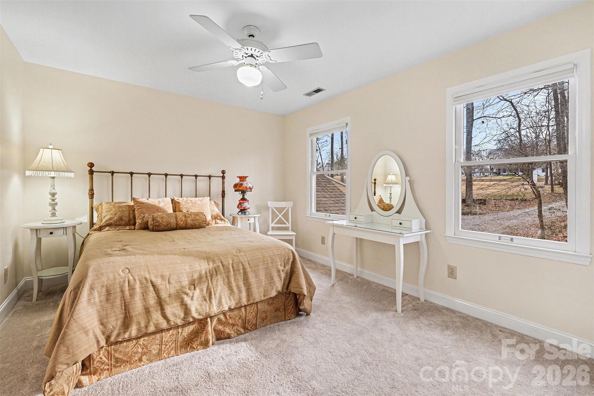 909 Woodland Forest Road Waxhaw, NC 28173 - Photo 9 of 38 a bedroom with a large bed and a window