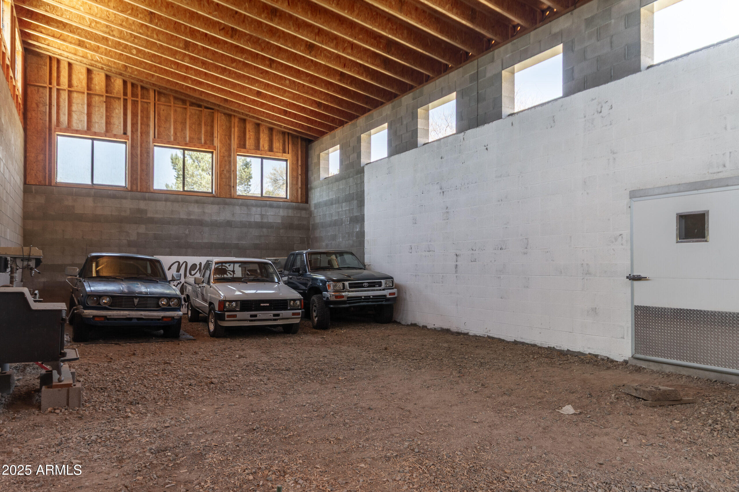 1360 Grisby Road Skull Valley, AZ 86338 - Photo 58 of 77 Large-Backroom-of-Workshop.-LG-White-Doo