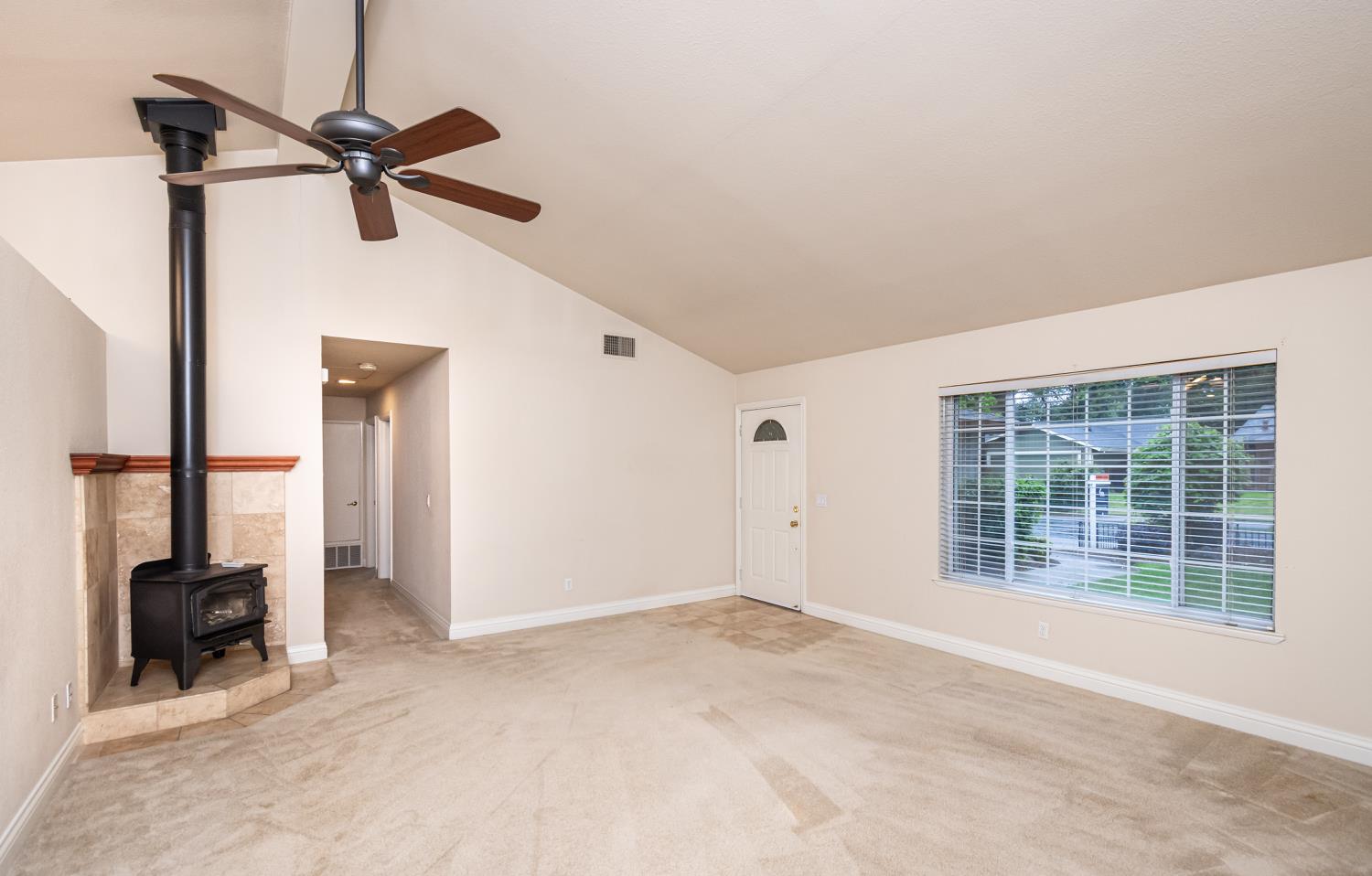 5705 Tudor Way Loomis, CA 95650 - Photo 12 of 59 a view of a livingroom with a ceiling fan and a window