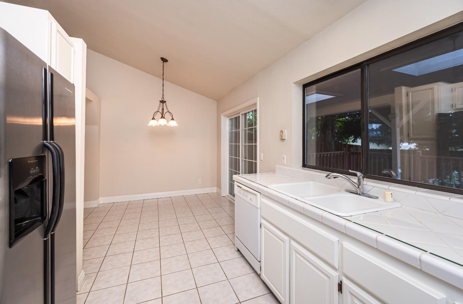 5705 Tudor Way Loomis, CA 95650 - Photo 23 of 59 a bathroom with a sink a mirror and a shower