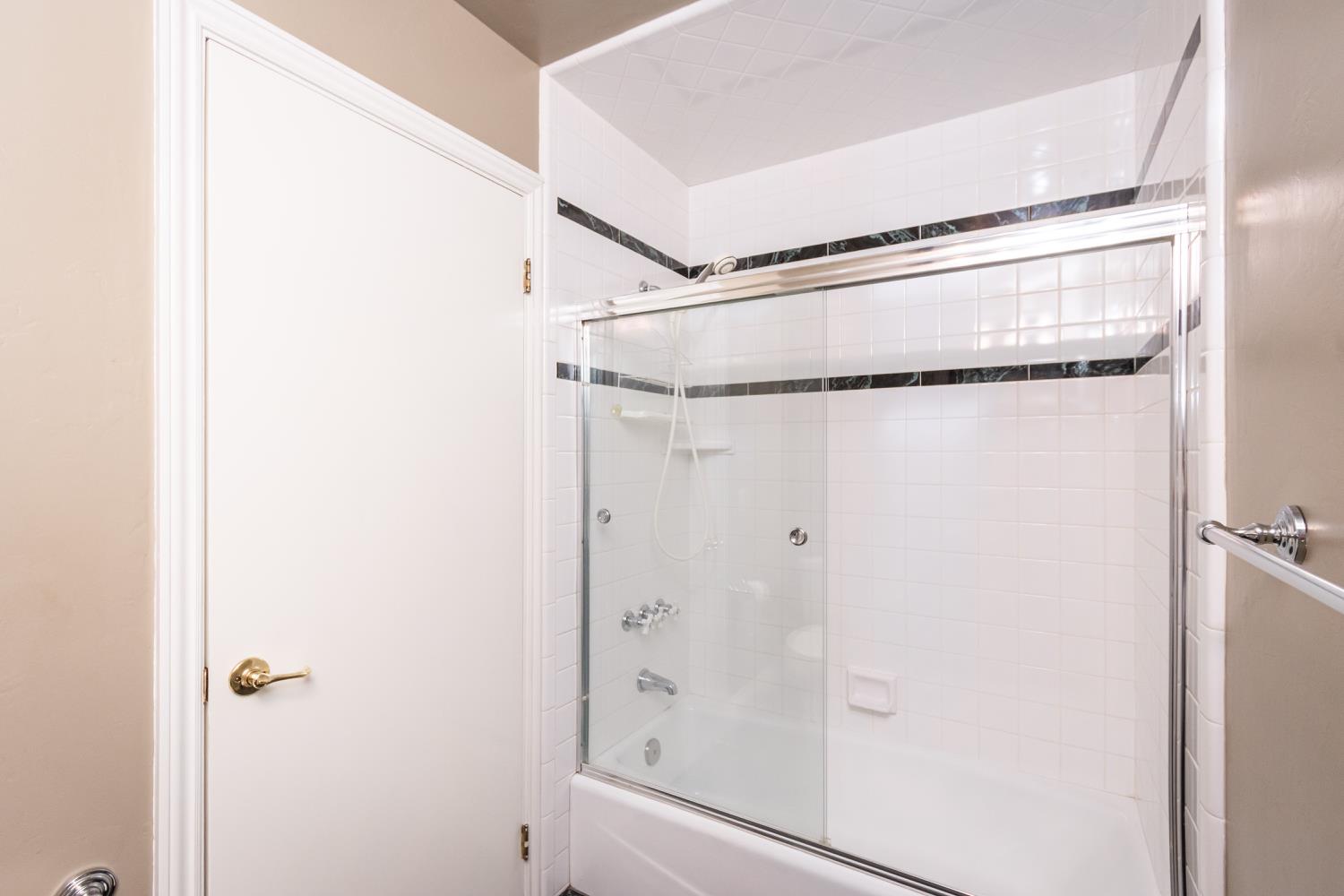 5705 Tudor Way Loomis, CA 95650 - Photo 25 of 59 a bathroom with a glass shower door