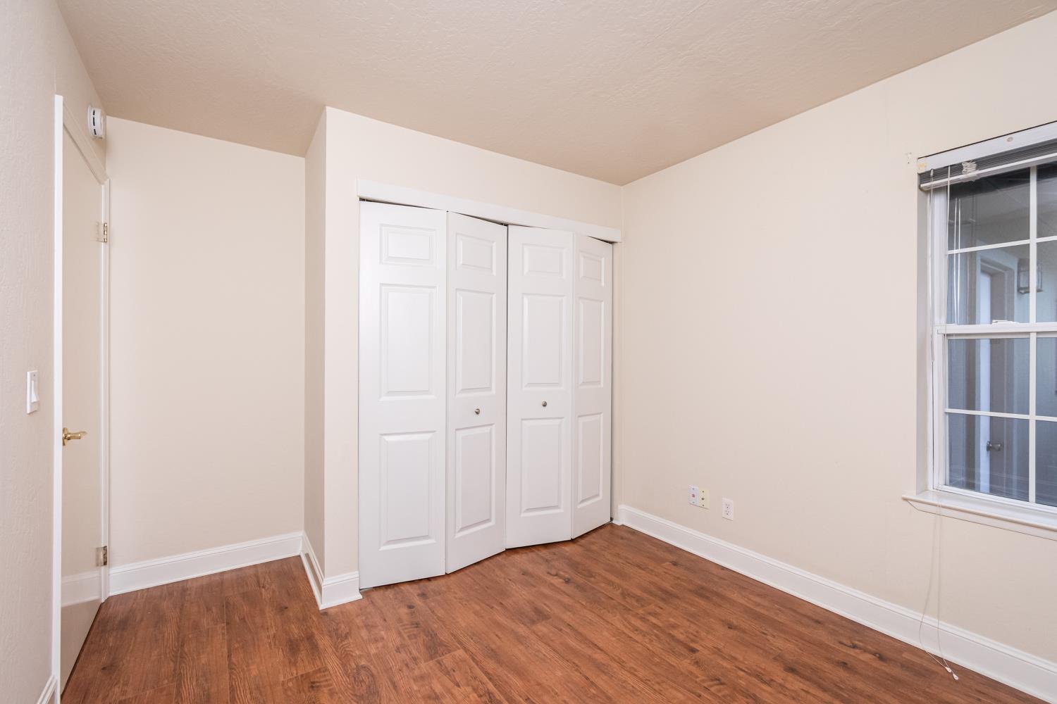5705 Tudor Way Loomis, CA 95650 - Photo 27 of 59 a view of an empty room with wooden floor and closet