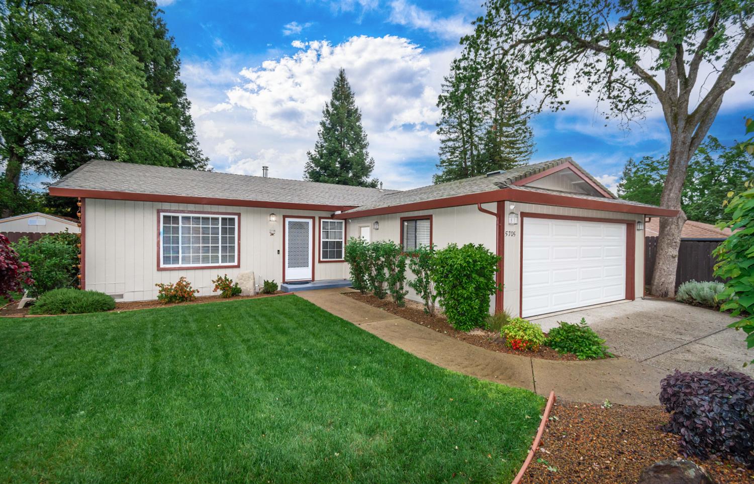 5705 Tudor Way Loomis, CA 95650 - Photo 3 of 59 a front view of a house with a yard and garage