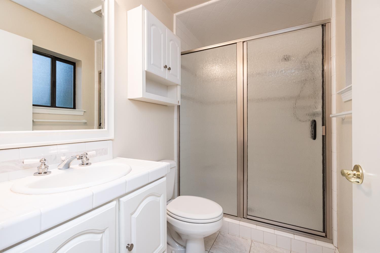 5705 Tudor Way Loomis, CA 95650 - Photo 33 of 59 a bathroom with a sink toilet and shower