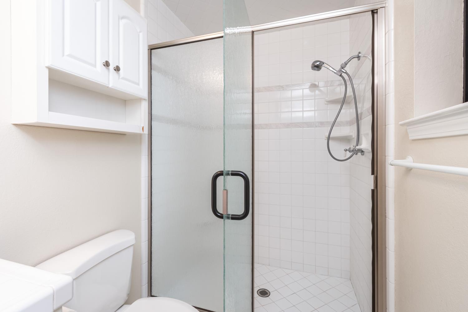 5705 Tudor Way Loomis, CA 95650 - Photo 34 of 59 a bathroom with a granite countertop shower a toilet and sink