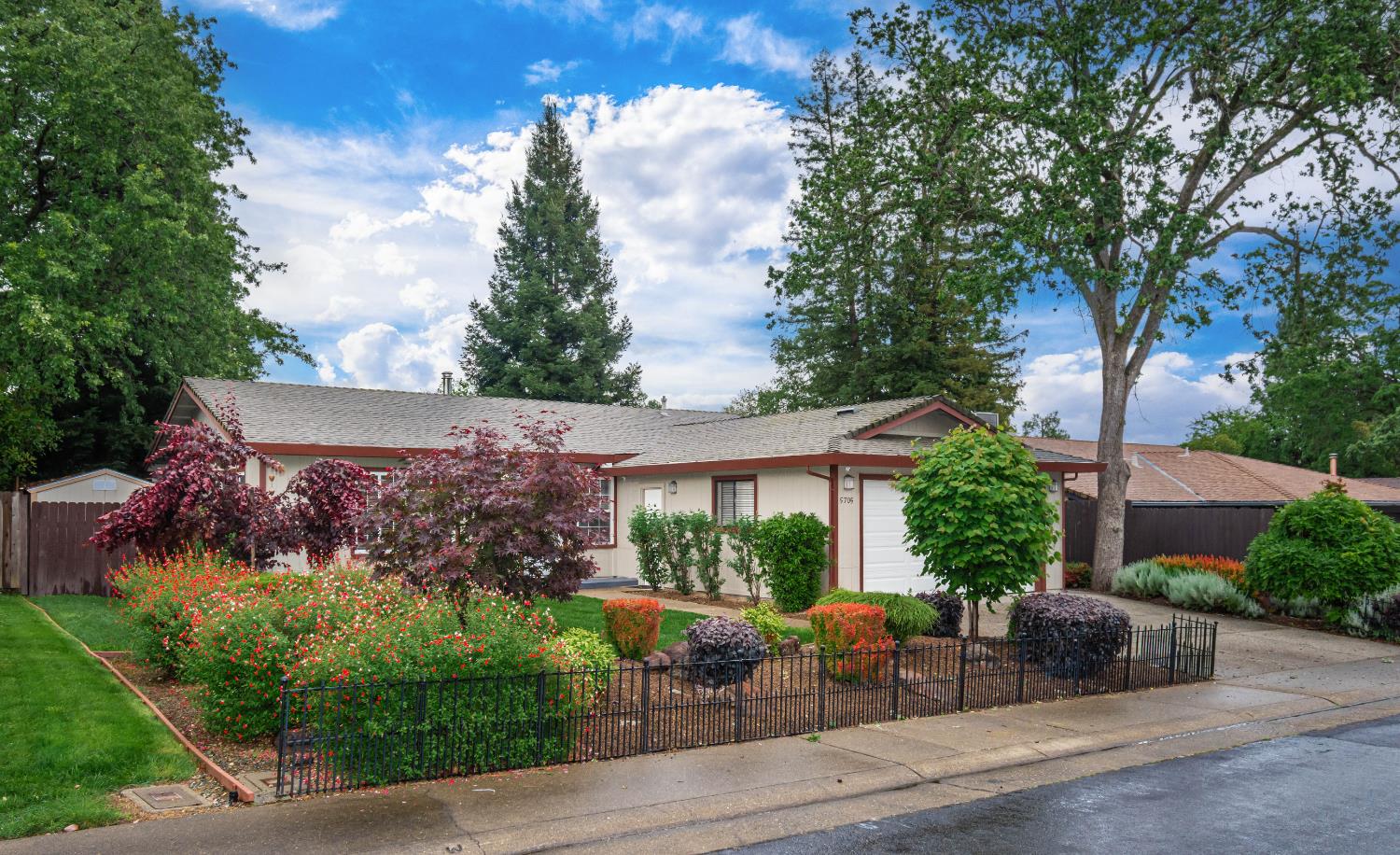 5705 Tudor Way Loomis, CA 95650 - Photo 4 of 59 front view of a house with a garden