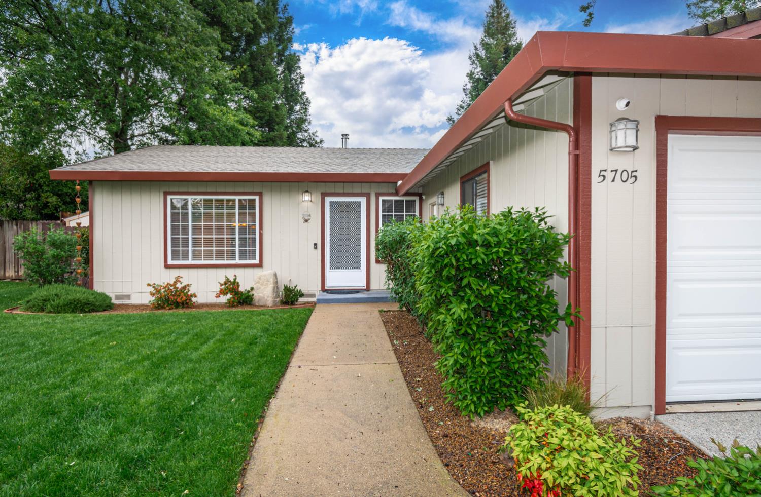 5705 Tudor Way Loomis, CA 95650 - Photo 6 of 59 a front view of a house with a yard and trees
