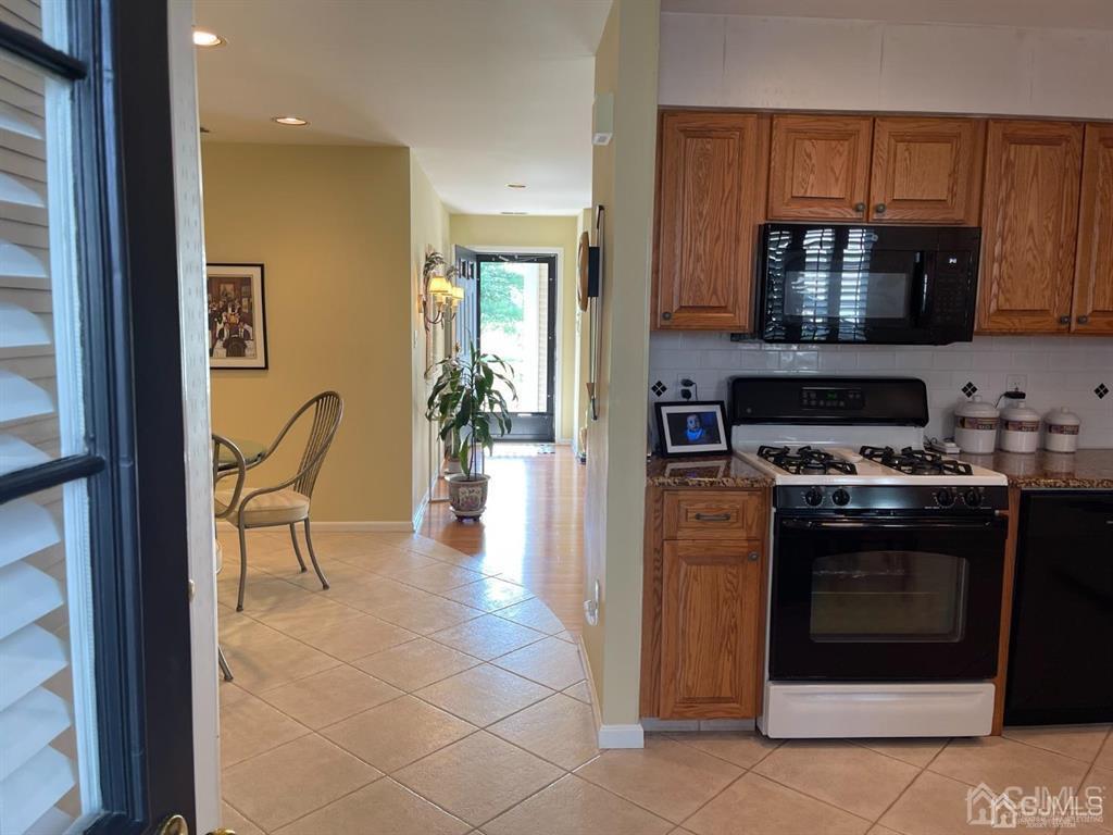 70 A Winthrop Road Monroe Township, NJ 08831 - Photo 17 of 50 a kitchen with a stove and a microwave