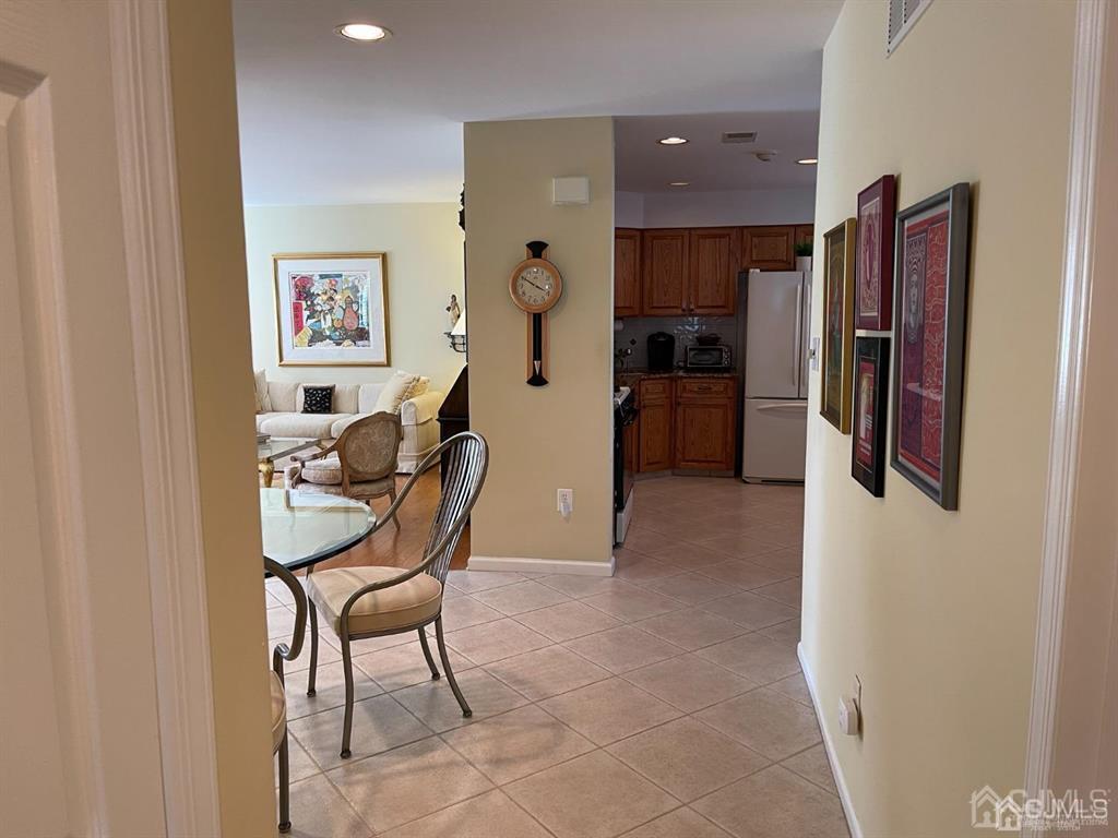 70 A Winthrop Road Monroe Township, NJ 08831 - Photo 21 of 50 a dining room with furniture and stainless steel appliances