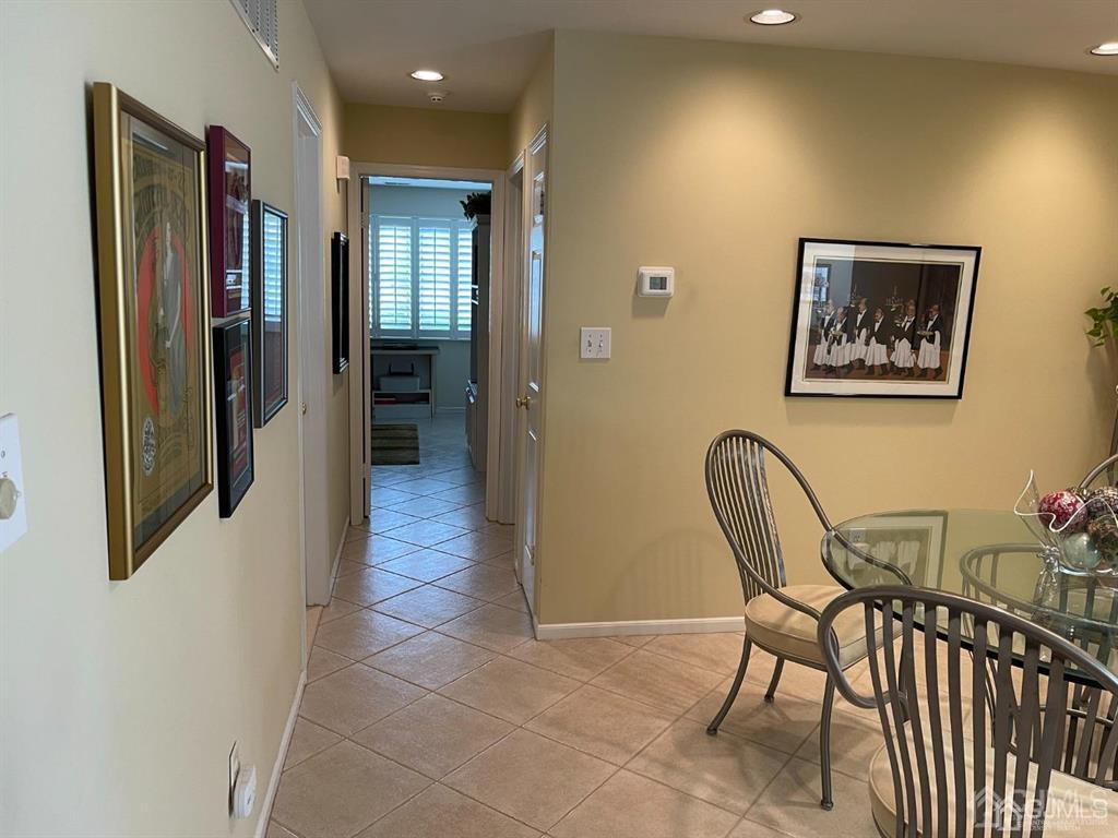 70 A Winthrop Road Monroe Township, NJ 08831 - Photo 22 of 50 a view of a hallway to a livingroom with furniture and windows