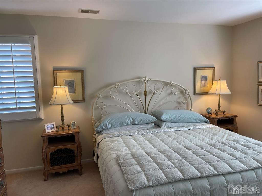 70 A Winthrop Road Monroe Township, NJ 08831 - Photo 24 of 50 a bedroom with a bed and a lamp