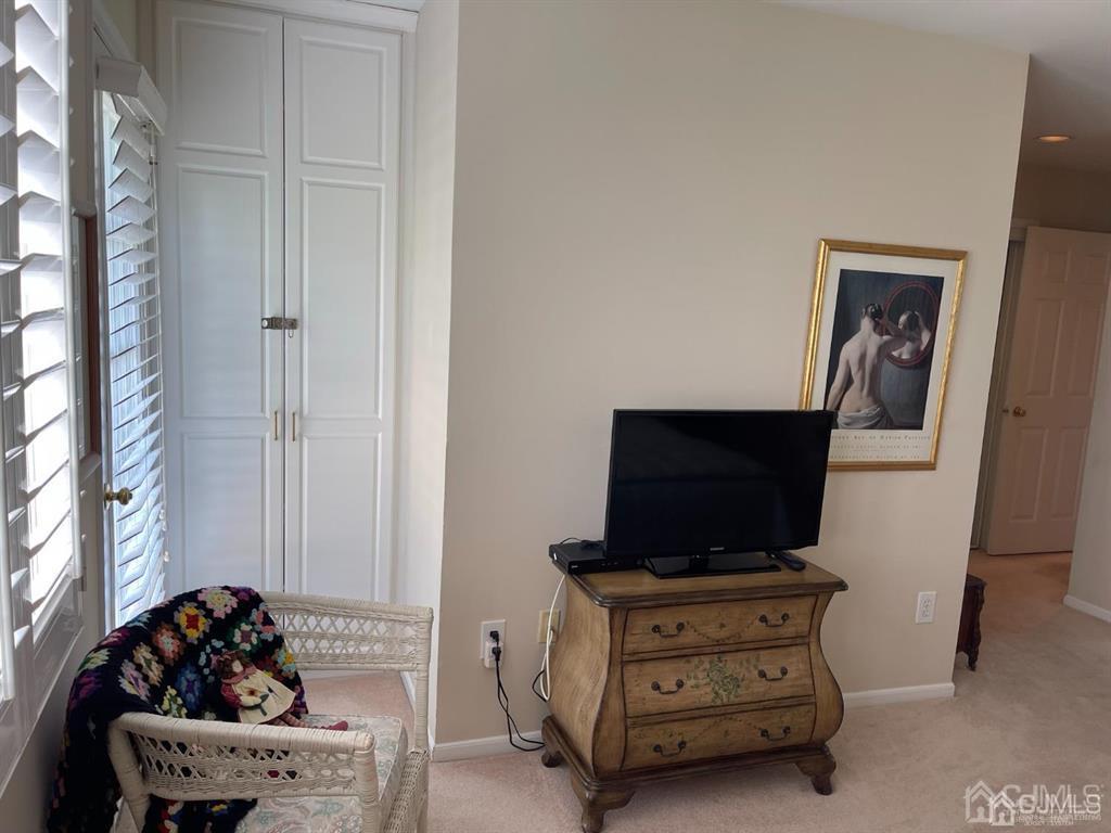 70 A Winthrop Road Monroe Township, NJ 08831 - Photo 27 of 50 a living room with furniture and a flat screen tv