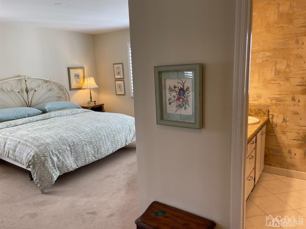 70 A Winthrop Road Monroe Township, NJ 08831 - Photo 29 of 50 a bedroom with a bed and wall painting