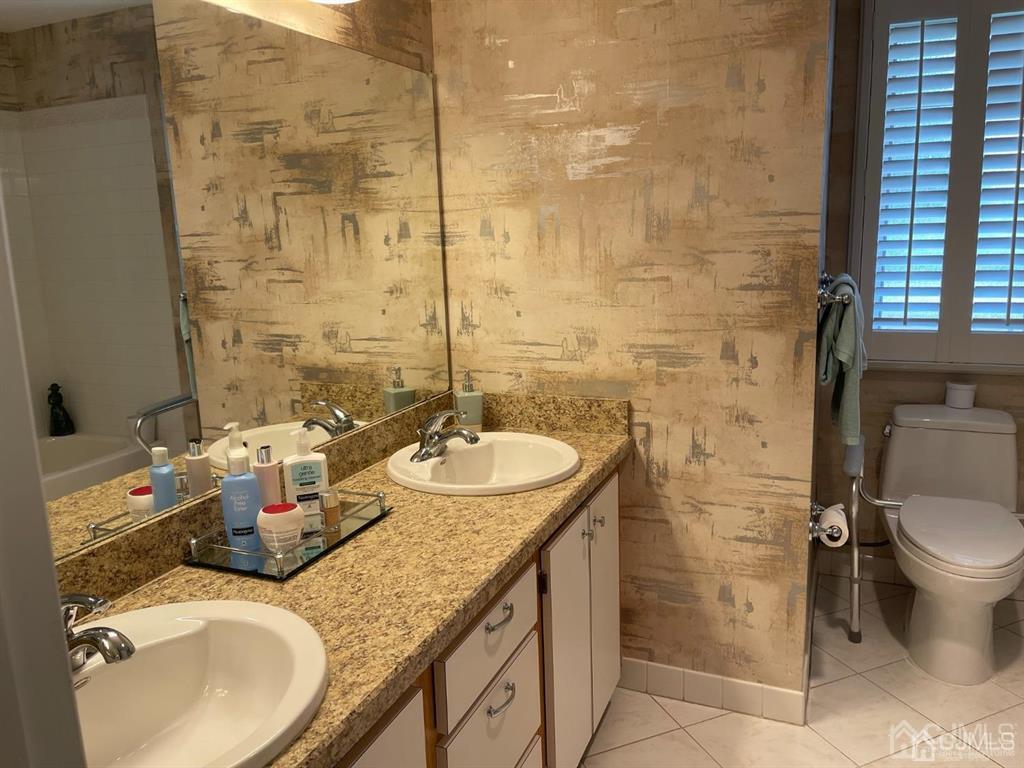 70 A Winthrop Road Monroe Township, NJ 08831 - Photo 31 of 50 a bathroom with a granite countertop sink toilet and shower