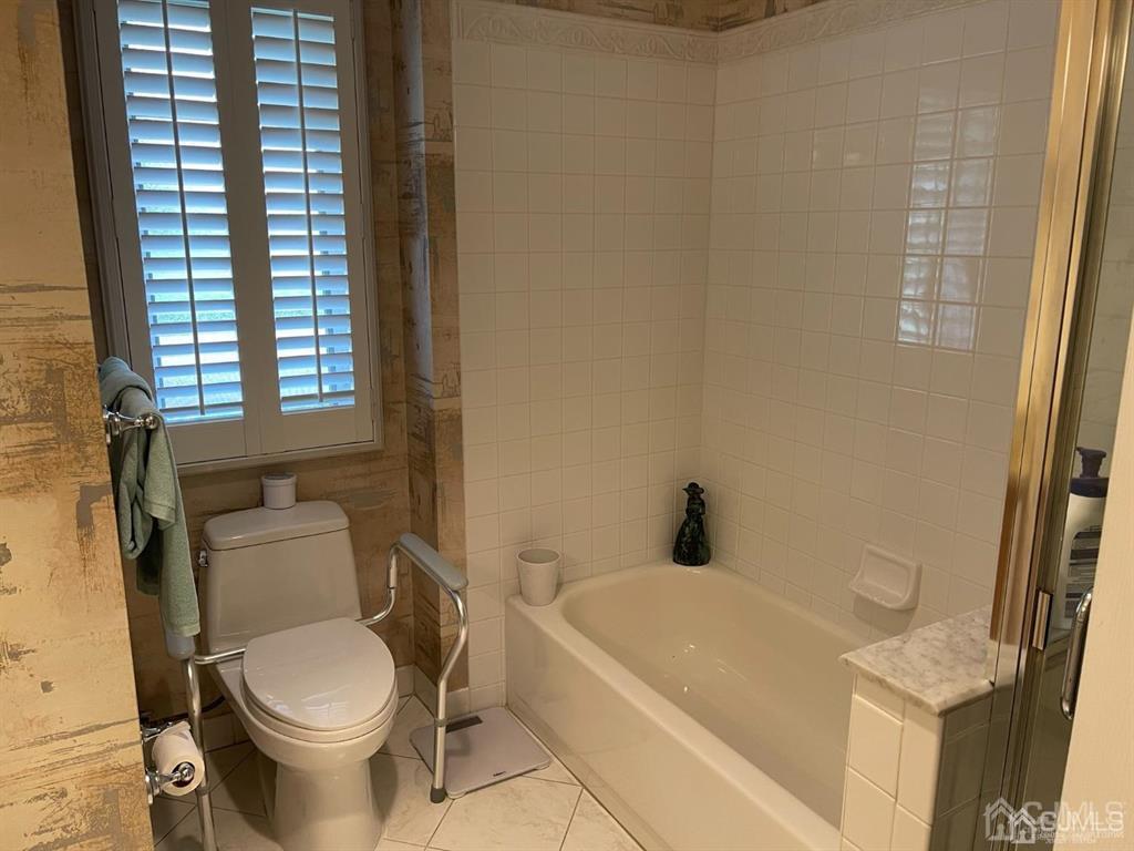 70 A Winthrop Road Monroe Township, NJ 08831 - Photo 32 of 50 a white toilet sitting next to a bath tub